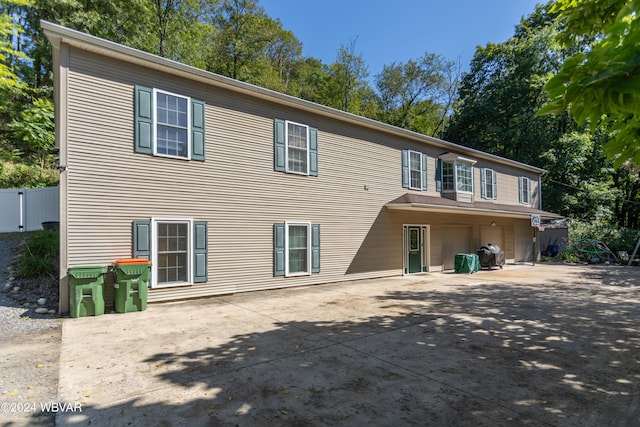 back of property with a patio