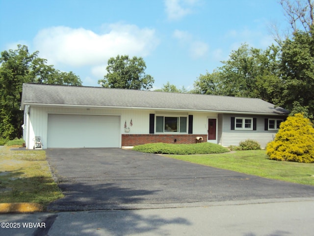 117 Oak Ln, Lock Haven, PA 17745 - view of front of property featuring an attached garage, asphalt driveway, brick siding, and a front yard