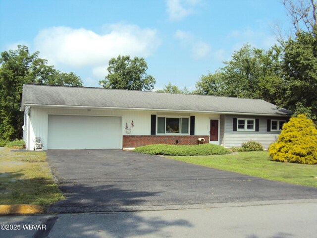 117 Oak Ln, Lock Haven, PA 17745 - view of front of property featuring an attached garage, asphalt driveway, brick siding, and a front yard