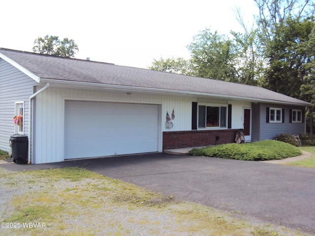 117 Oak Ln, Lock Haven, PA 17745 - single story home with a garage, driveway, and brick siding