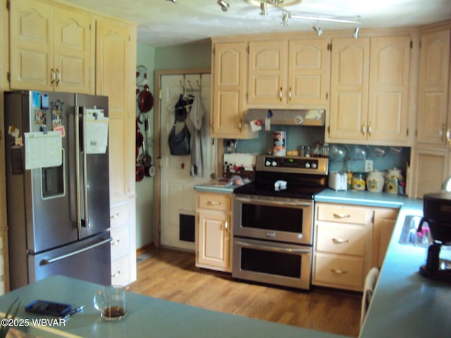 117 Oak Ln, Lock Haven, PA 17745 - kitchen featuring appliances with stainless steel finishes, light countertops, light wood-type flooring, and light brown cabinets