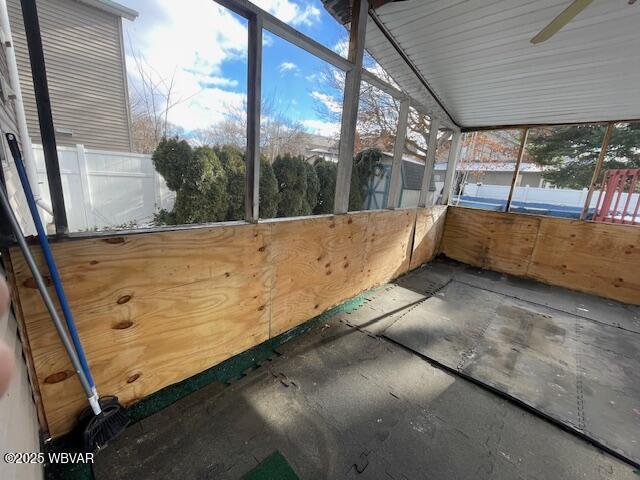 unfurnished sunroom with vaulted ceiling