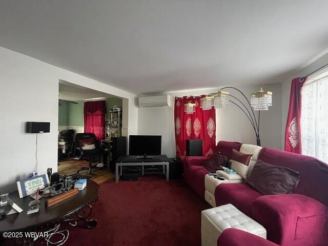 carpeted living room with a wall unit AC