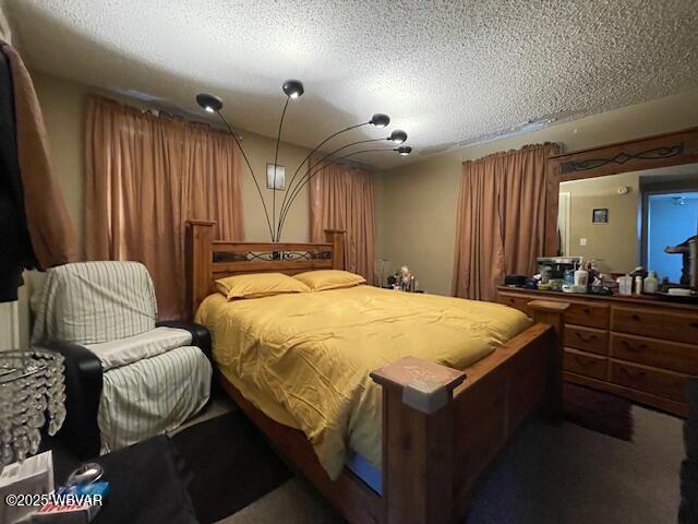 bedroom featuring a textured ceiling