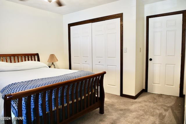 bedroom with light colored carpet and a closet