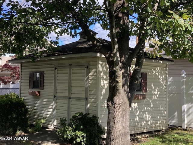 view of property exterior featuring a storage unit