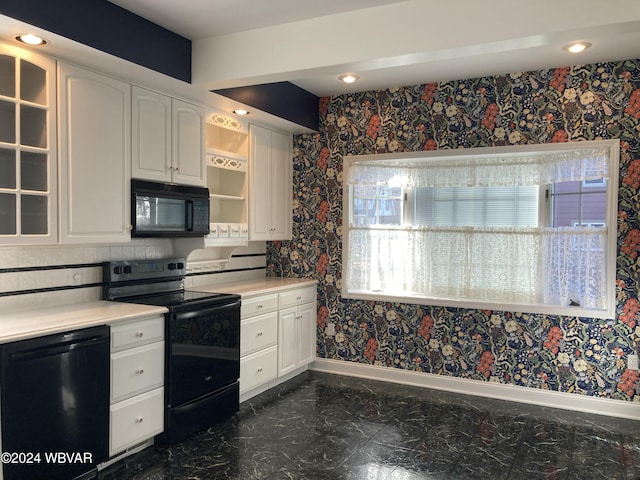 kitchen featuring white cabinetry and black appliances