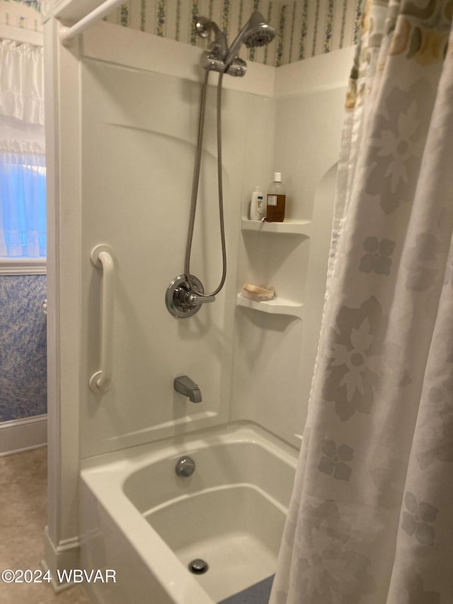 bathroom featuring shower / tub combo with curtain