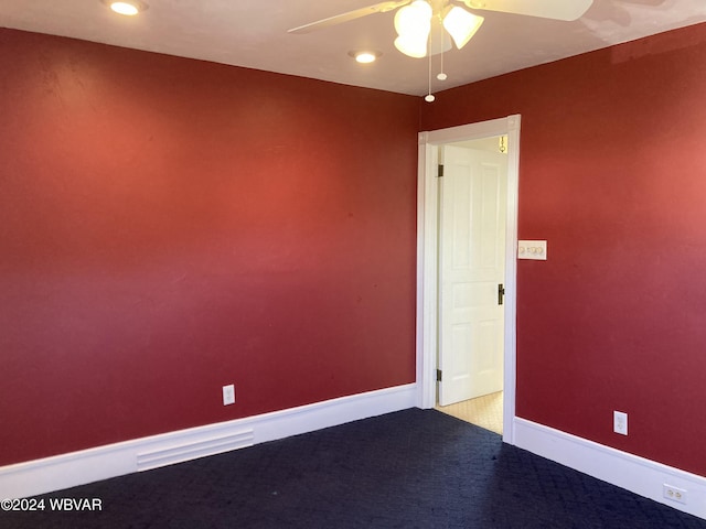 empty room featuring carpet and ceiling fan