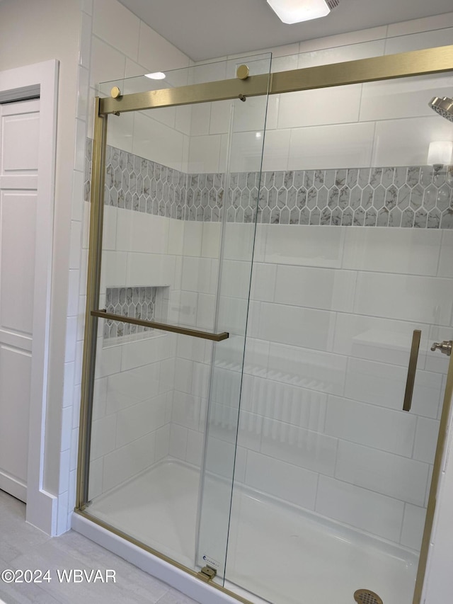 bathroom featuring an enclosed shower