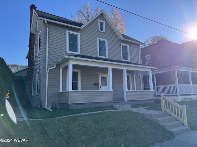 view of front of property featuring a porch and a front yard