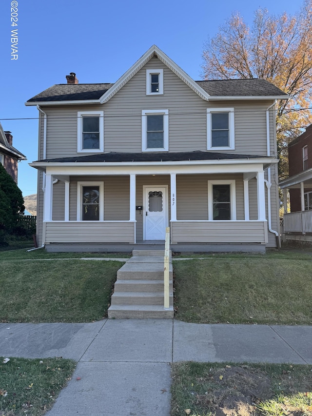 view of front of home featuring a porch and a front lawn