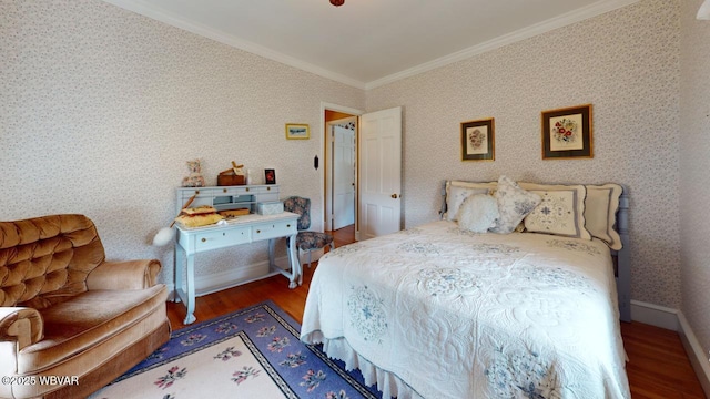 bedroom featuring crown molding, baseboards, dark wood finished floors, and wallpapered walls