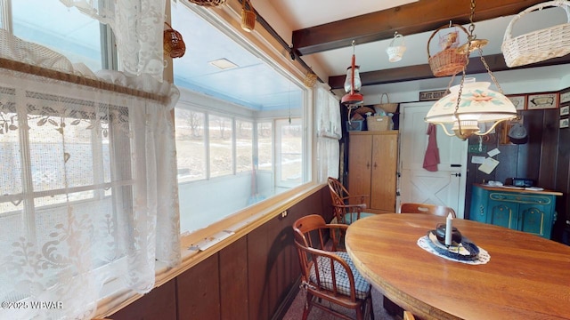 dining room featuring beam ceiling