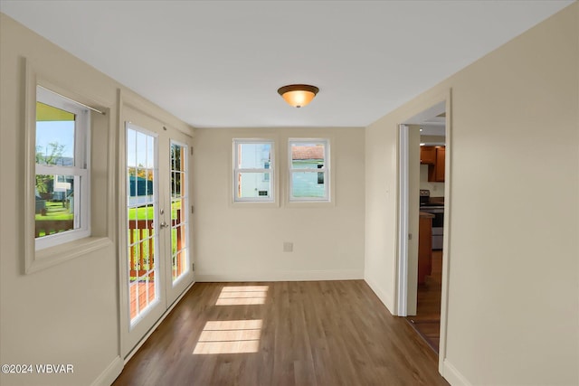 doorway to outside featuring french doors and dark wood-type flooring