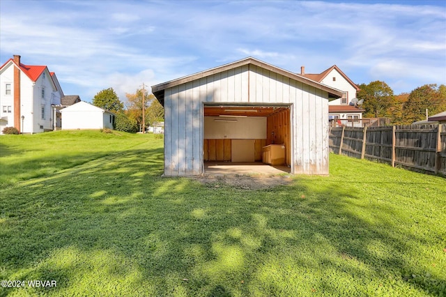 view of outbuilding featuring a lawn