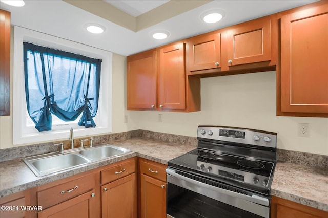 kitchen featuring sink and electric stove