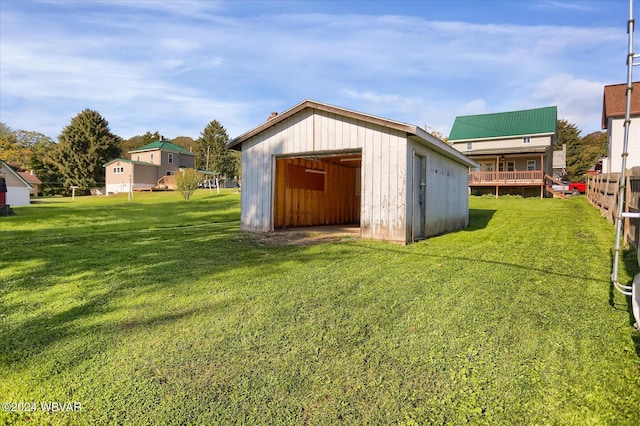 view of outdoor structure featuring a lawn