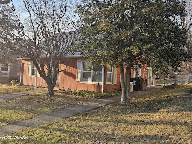 view of property exterior featuring fence