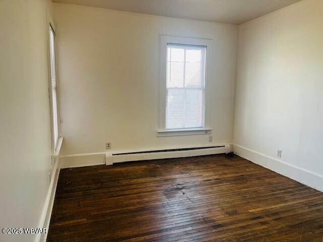 additional living space with light wood-type flooring and vaulted ceiling