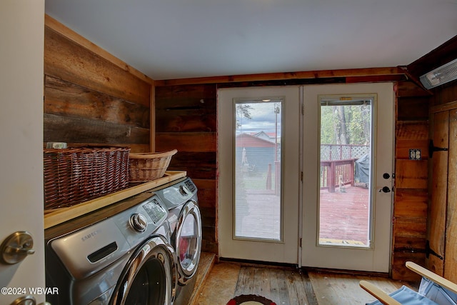 laundry room featuring laundry area, light wood-type flooring, and washer and dryer