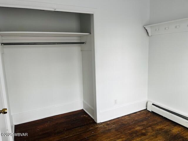 closet with a baseboard radiator