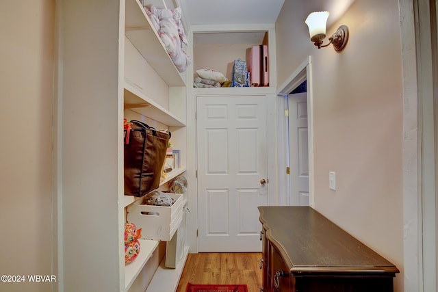 mudroom with light hardwood / wood-style flooring