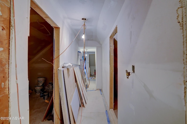 corridor with lofted ceiling