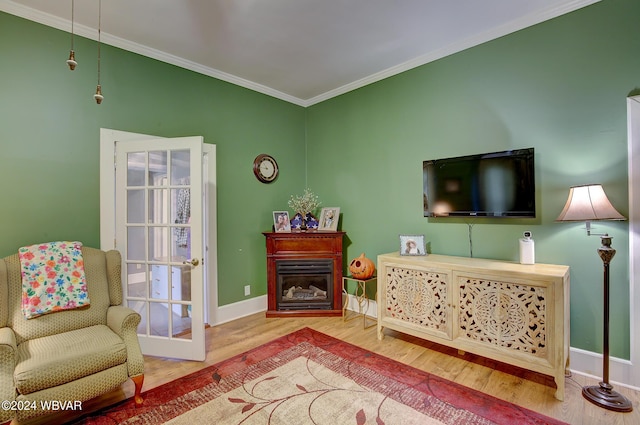 living room featuring ornamental molding and hardwood / wood-style floors