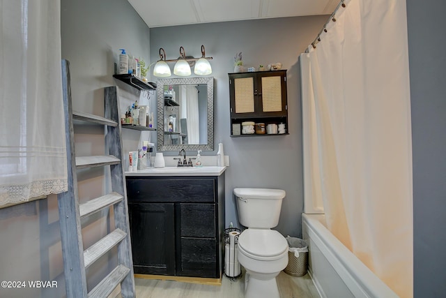 full bathroom featuring toilet, vanity, shower / bath combination with curtain, and hardwood / wood-style floors