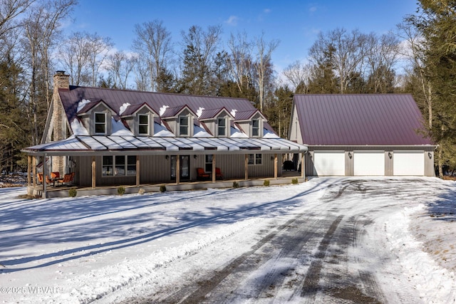 view of front of home with a garage and a porch