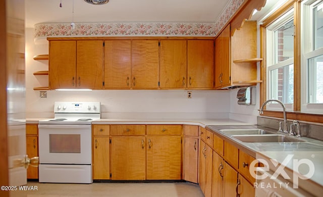 kitchen with electric range, open shelves, a sink, and light countertops