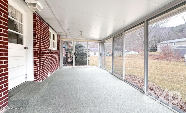 unfurnished sunroom with plenty of natural light