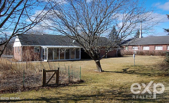 view of yard featuring a sunroom