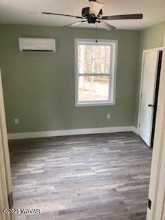 131 Spring House Rd, Muncy Valley, PA 17758 - interior space with a wall mounted air conditioner, ceiling fan, baseboards, and wood finished floors