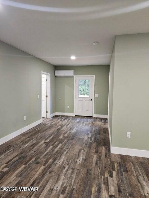 131 Spring House Rd, Muncy Valley, PA 17758 - spare room featuring baseboards, wood finished floors, an AC wall unit, and recessed lighting