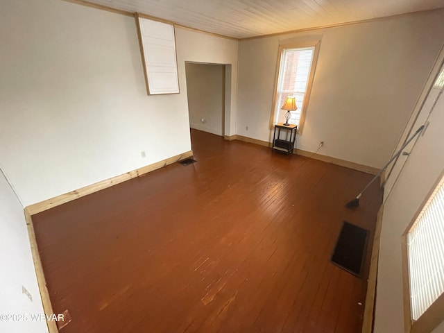 unfurnished room with dark hardwood / wood-style floors and ornamental molding