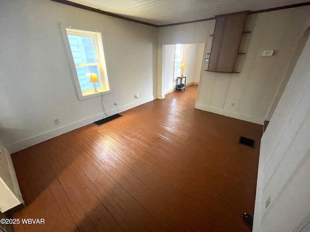 unfurnished room with hardwood / wood-style flooring and ornamental molding