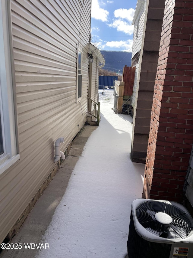 view of side of property with central AC unit