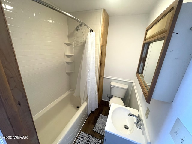 full bathroom with toilet, sink, shower / bathtub combination with curtain, and hardwood / wood-style flooring