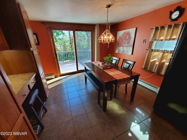 tiled dining room with a baseboard radiator