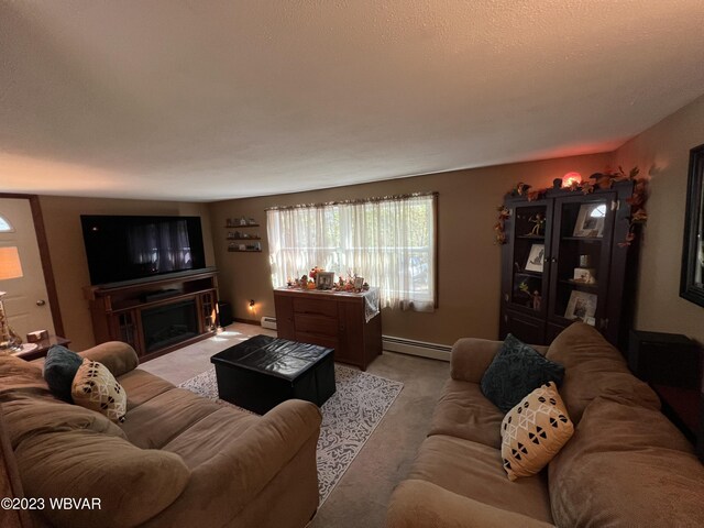 living room featuring light carpet, a textured ceiling, and a baseboard radiator