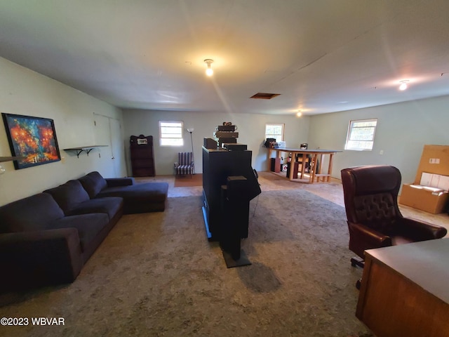 living room featuring carpet flooring and a wealth of natural light