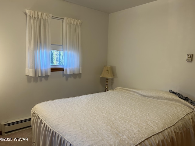 bedroom with a baseboard heating unit