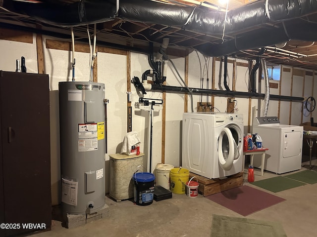 unfinished below grade area featuring water heater and separate washer and dryer