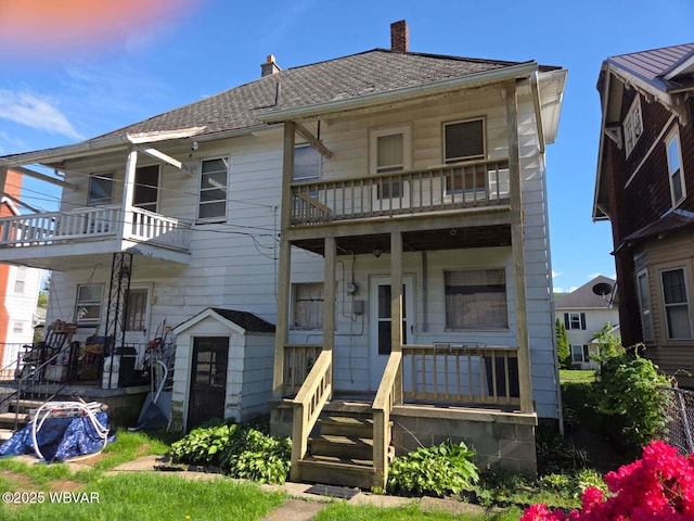 2602 W Fourth St, Williamsport, PA 17701 - view of front facade featuring a balcony, a porch, and a chimney