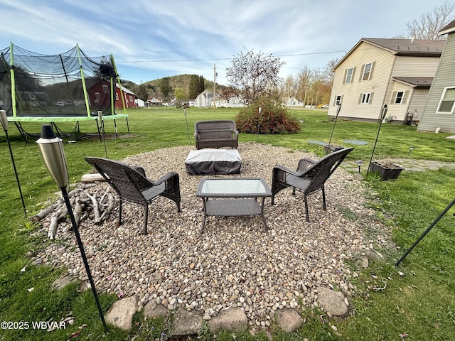 view of yard featuring a trampoline