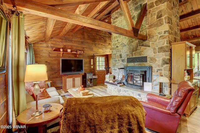 1640 Pleasant Valley Rd, Cogan Station, PA 17728 - living area featuring wooden ceiling, wood finished floors, wood walls, and a stone fireplace