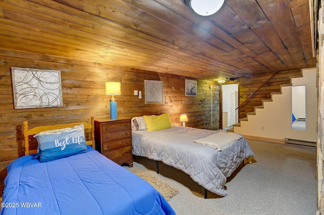 1640 Pleasant Valley Rd, Cogan Station, PA 17728 - bedroom with baseboard heating, wooden ceiling, carpet floors, and wood walls