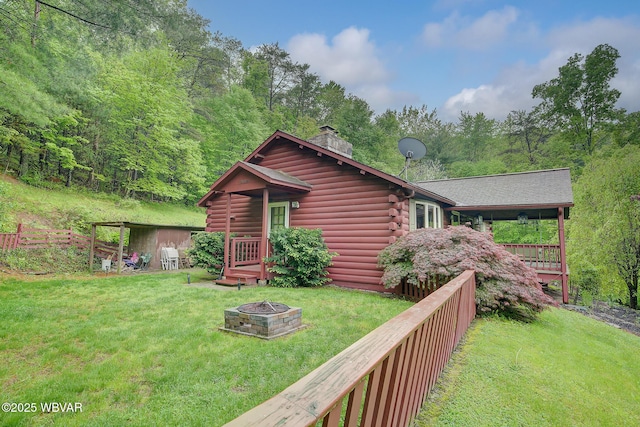 1640 Pleasant Valley Rd, Cogan Station, PA 17728 - back of property featuring a chimney, a fire pit, and log siding